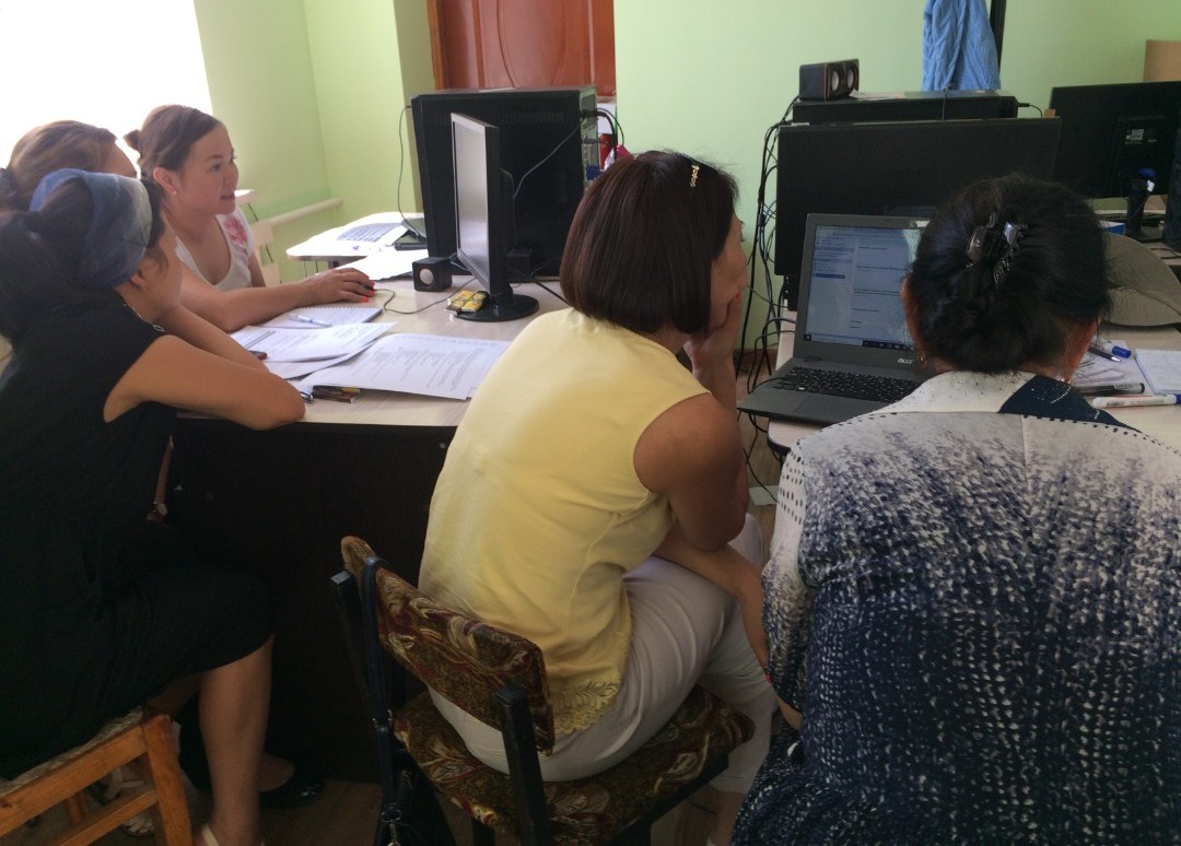 A project training with Meerman and Ayalzat Crisis Centers in the town of Karakol, Kyrgyzstan women at computers working