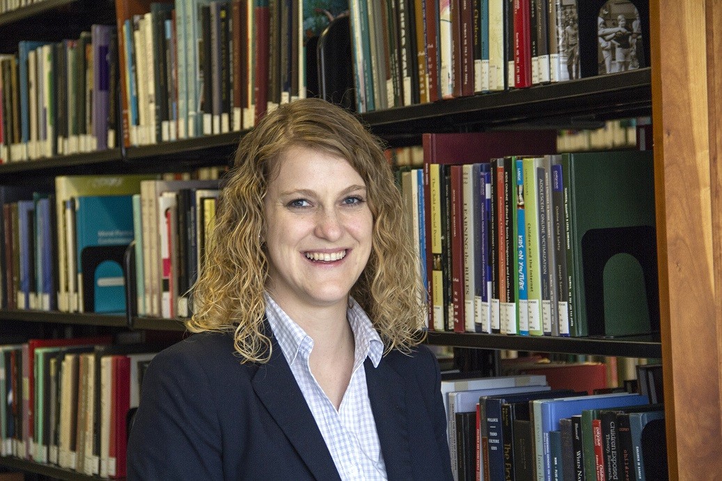 alissa in front of books