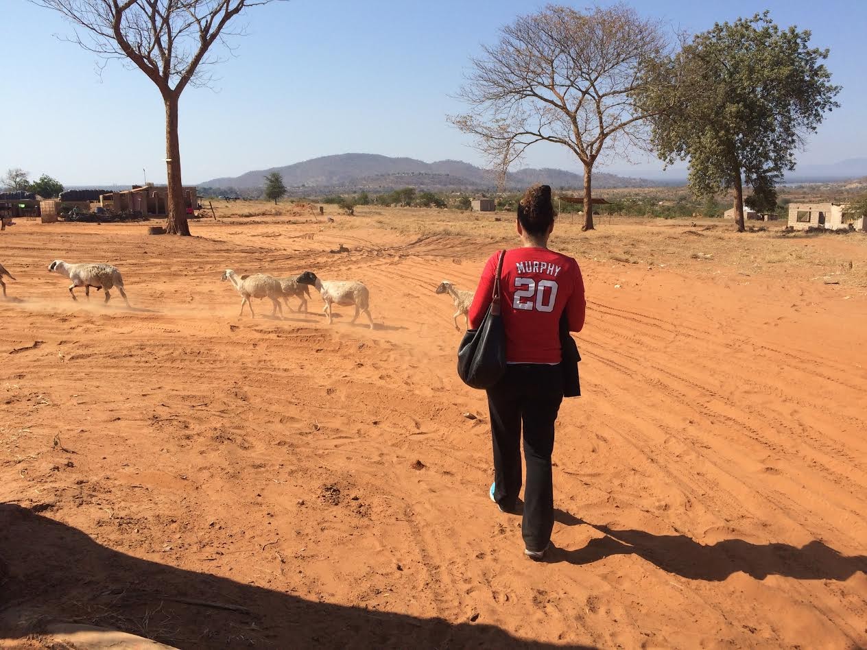 Dr. Lynn Murphy Michalopoulos walking at the truck stop border in Zambia