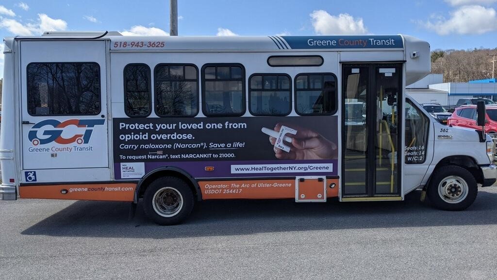 HEALing Communities Study (HCS) Partners in Greene County launched a six-month advertising campaign with signage installed on Greene County Transit vans, that travel throughout the county, educating residents about opioid use disorder. Photo credit: Timely Signs Mobile van with sign saying protect your loved ones from opioid overdose