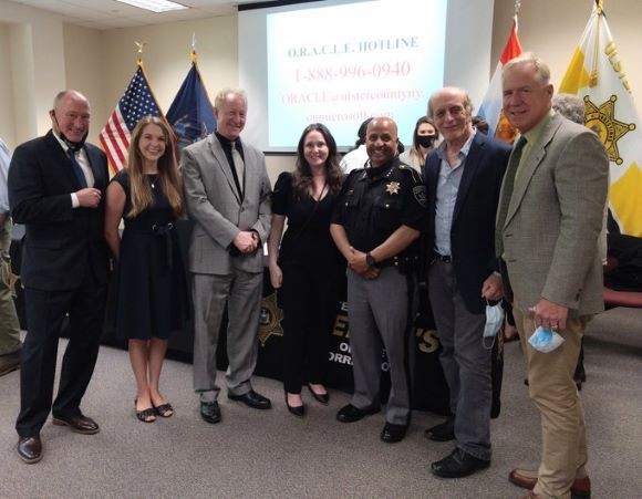 Left to right, Dave Clegg, Ulster County District Attorney Jillian Nadiak-Bruck, HCS Community Engagement Facilitator Steven Kelley, CEO, Ellenville Regional Hospital Juanita Hotchkiss, HCS Program manager Sheriff Juan Figueroa, Ulster County Vin Martello, Ulster County, Dir of Community Health Relations Tim Hunt, Columbia University HEALing Communites Study Team with Juan Figueroa, New York's Ulster County Sheriff