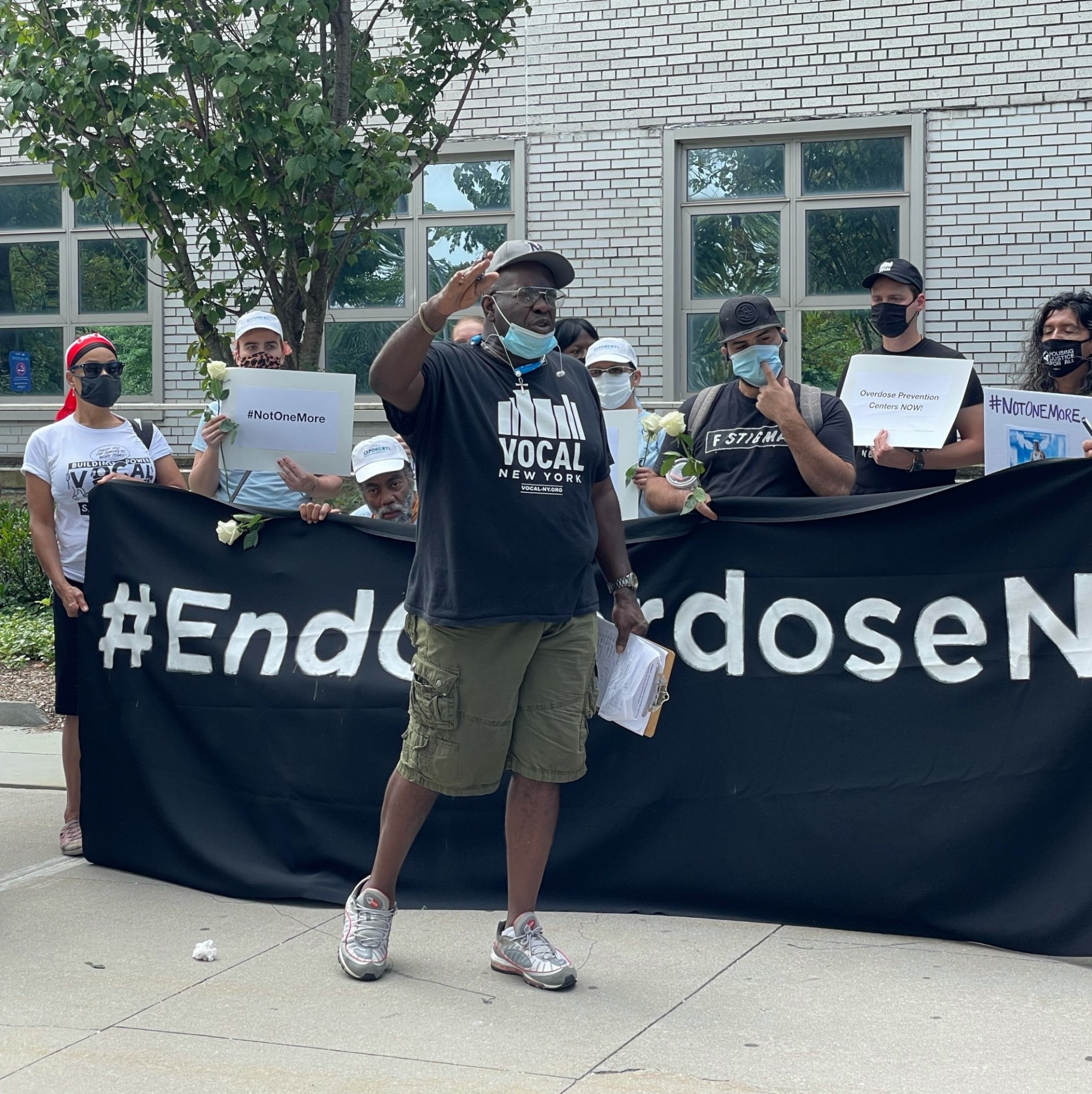 Will Robertson standing in front of group at overdose rally