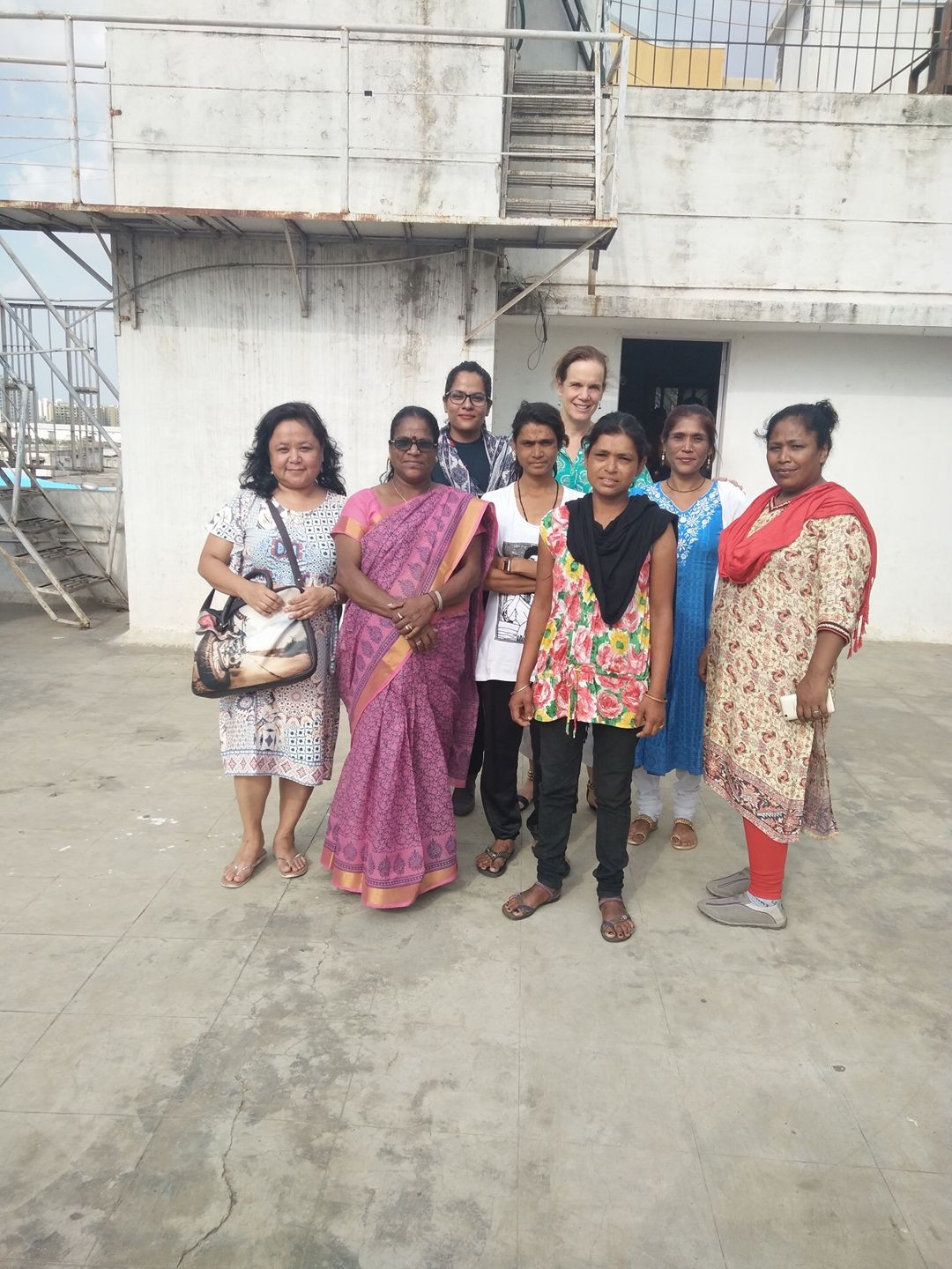 Women from the WINGS team standing in a group outside in India