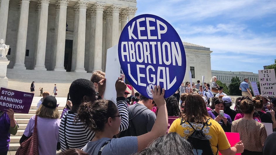 keep abortion legal sign held by protesters at the supreme court