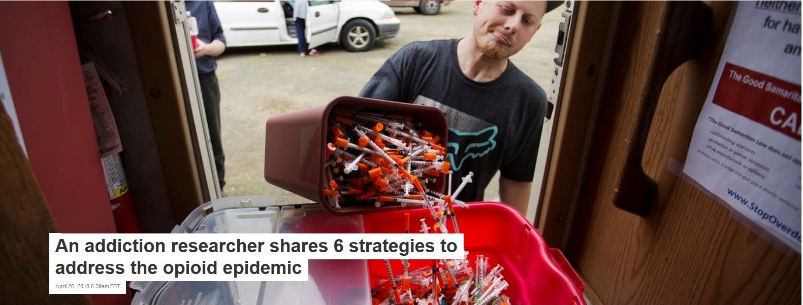 Stock photo of man disposing of needles