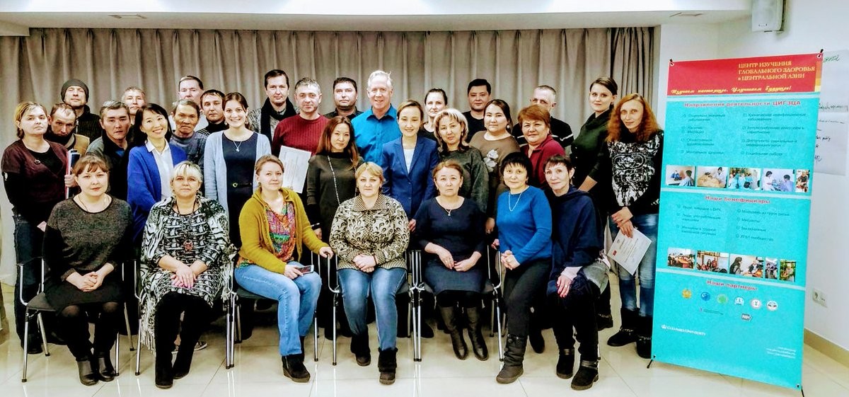 Bridge program training in Karaganda city January 2018, Outreach workers, nurses and doctors of Karaganda oblast AIDS center with GHRCCA Regional Director Dr. Assel Terlikbayeva, Project Directors Meruyert Darisheva and Tara McCrimmon, co-Investigator Dr. Timothy Hunt, and field staff. Group of people next to sign about the program