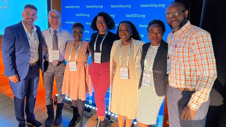 A group of people smiling at the camera.