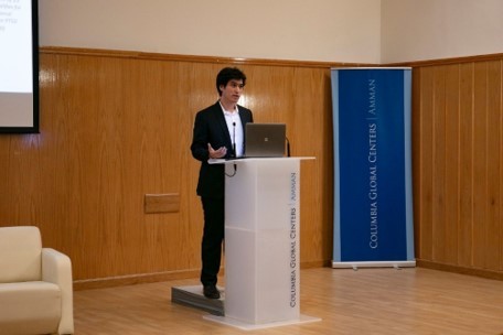 man presenting at a podium