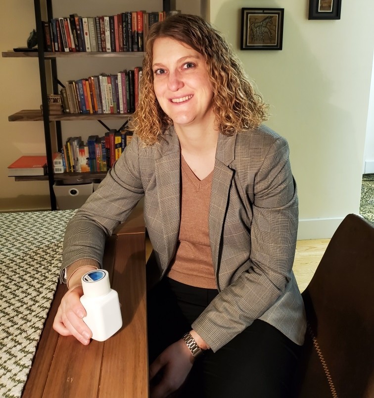 Principal Investigator Alissa Davis with the “smart” pill bottle used in Smart Couples II PI Alissa holding the pill bottle BETRCAP