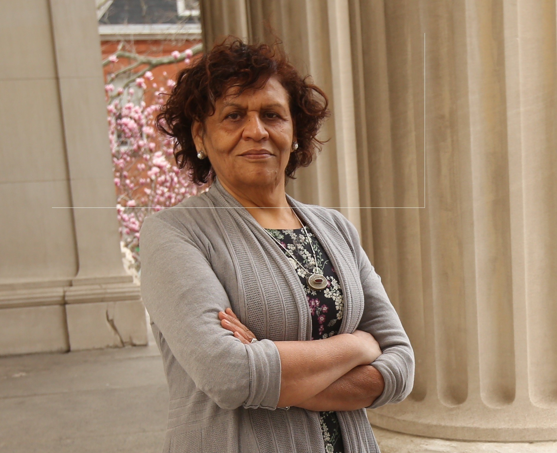 Dr. Nabila El-Bassel in front of a column