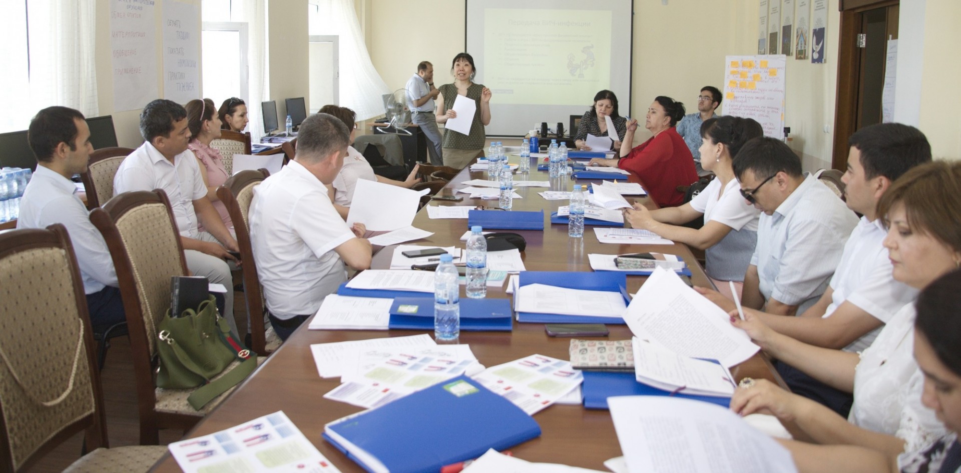 USWEEP Project Manager Lyudmila Kim delivers training to a full table of participants