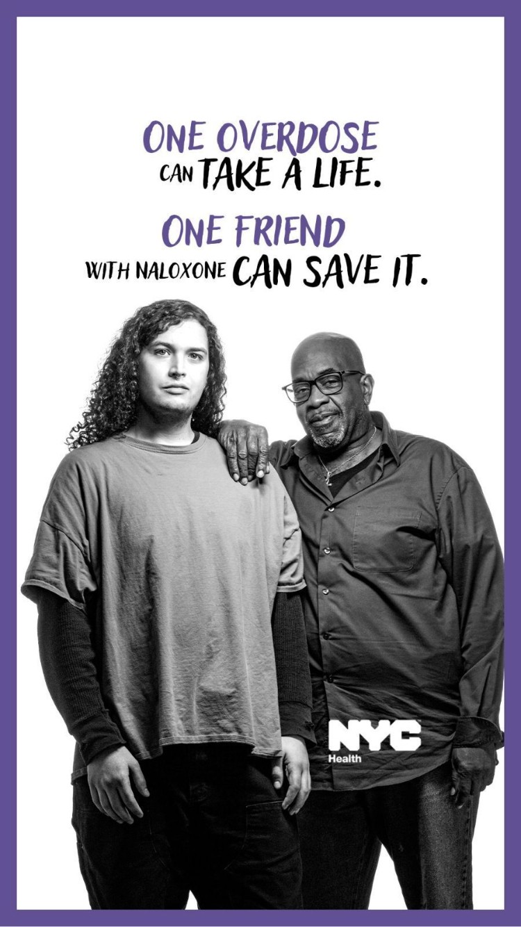 Will participating in a NYC overdose prevention and naloxone access awareness campaign. Two people on a white background. Text above their heads says "one overdose can take a life. One friend with naloxone can save it"