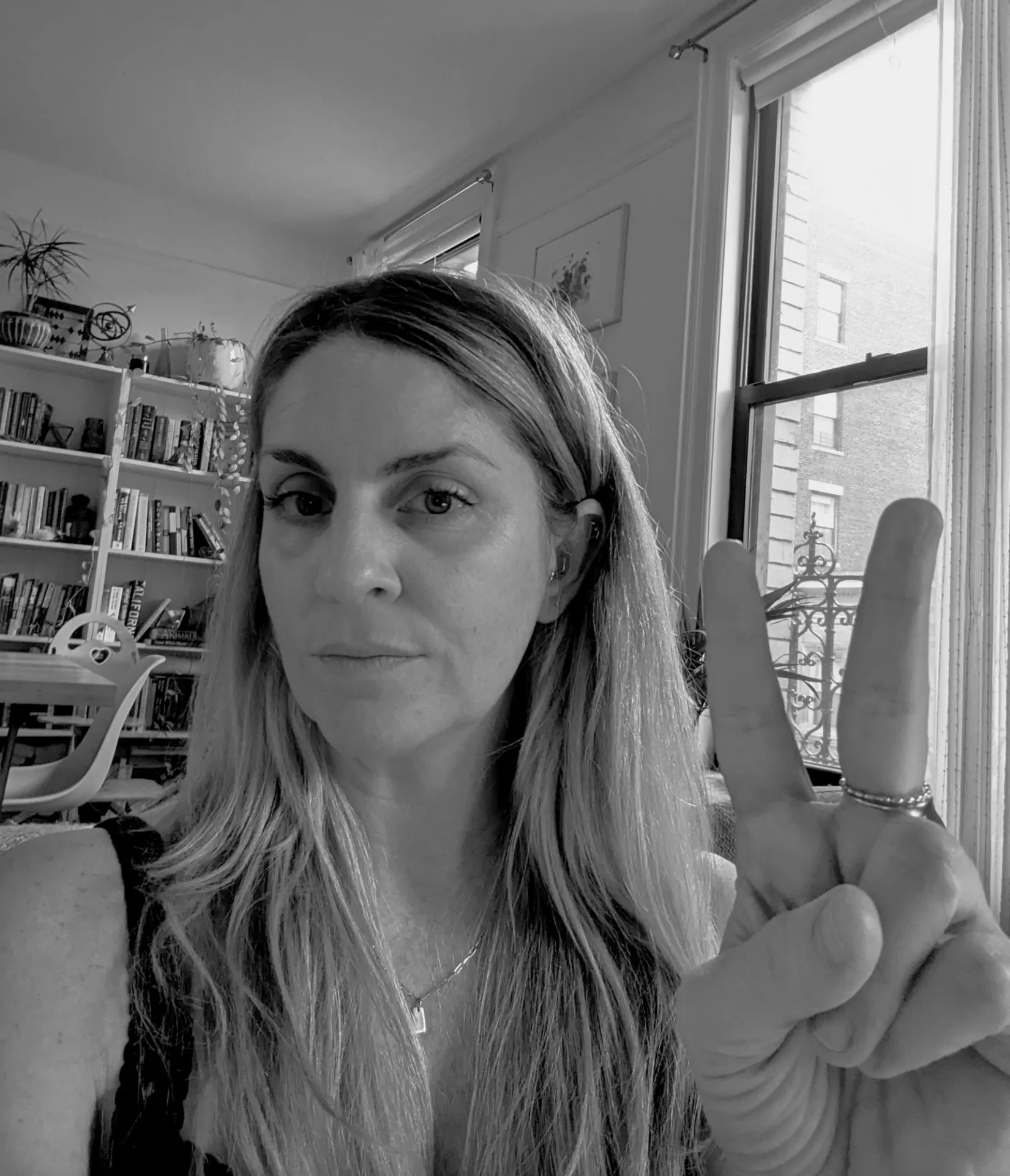 Brooke West holding up two fingers