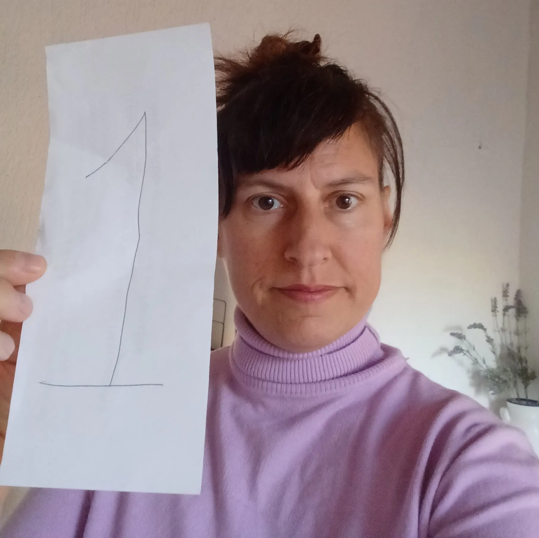 Eleni Vlachos with number 1 on piece of paper