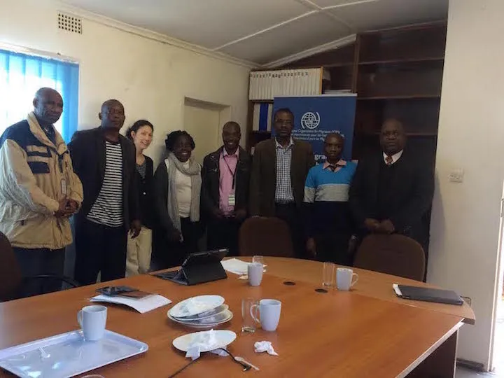 Study team interviewers standing in an office 