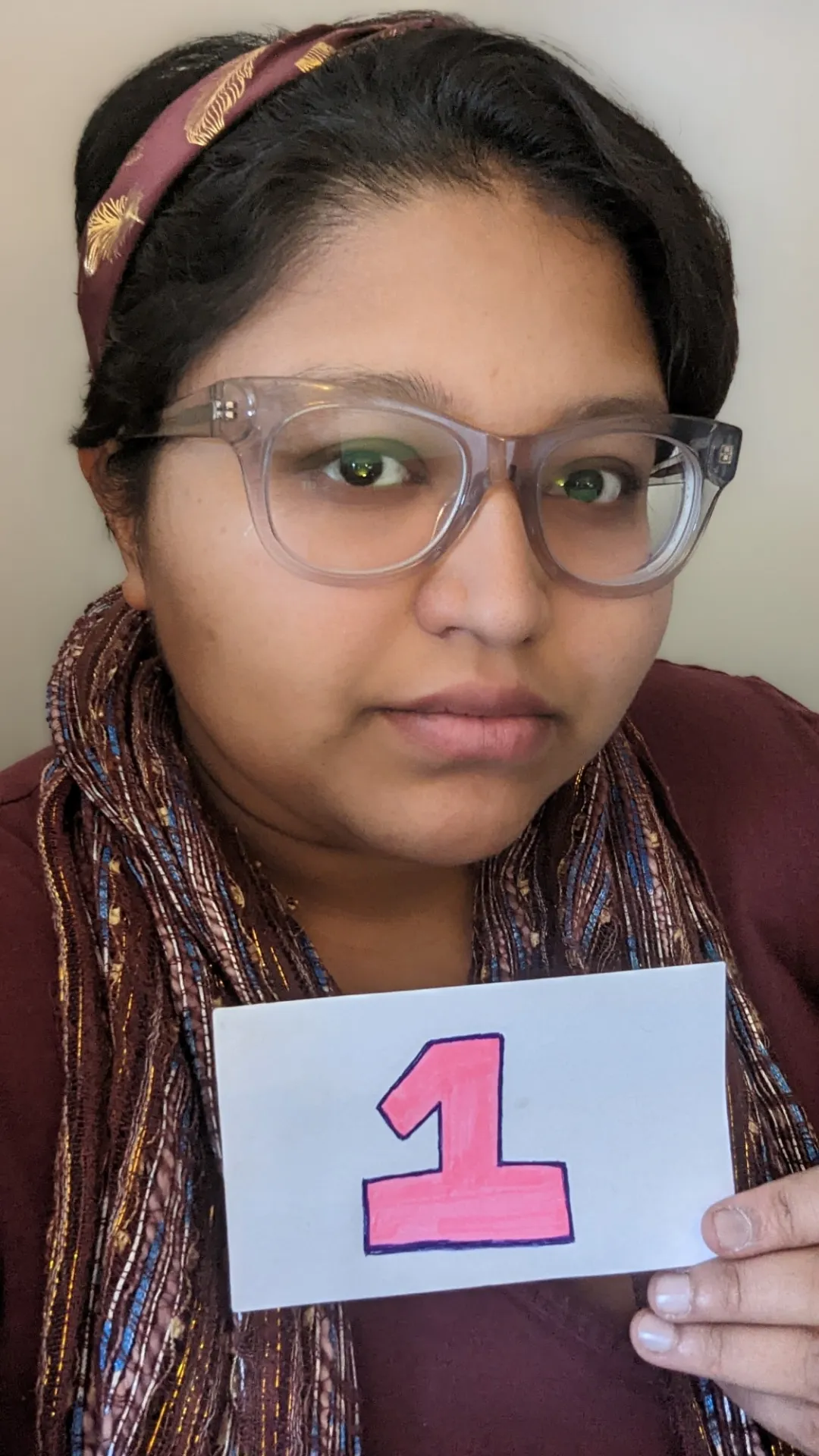 Nishita Dsouza holding the number one