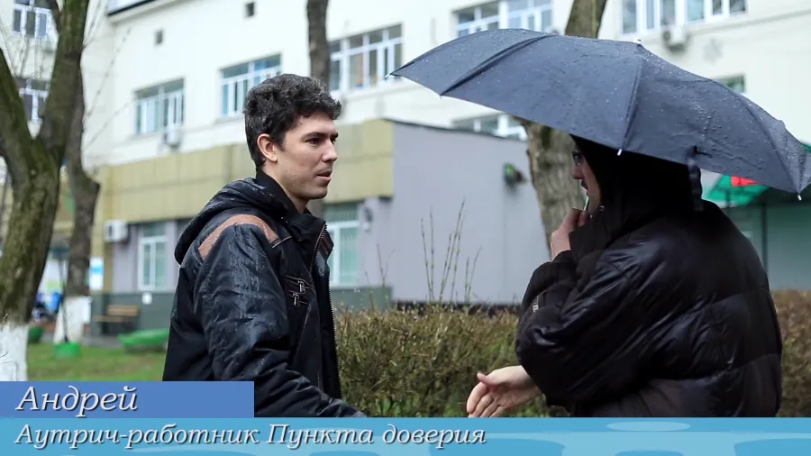 Outreach worker giving information to potential participant