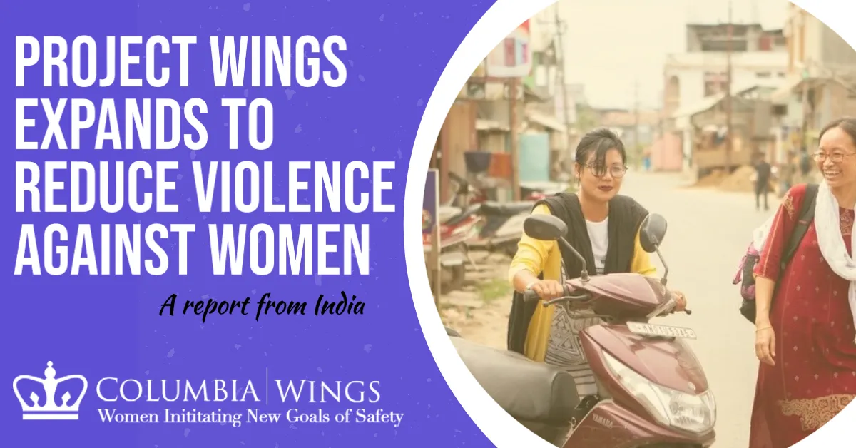 Women who work for WINGS pushing a motorcycle 