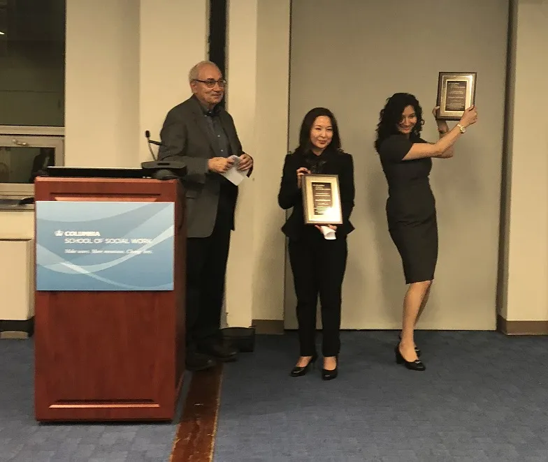 Associate Dean Allen Zweben presents the awards. Photo credit: Yong Gun (YG) Lee of the Social Intervention Group