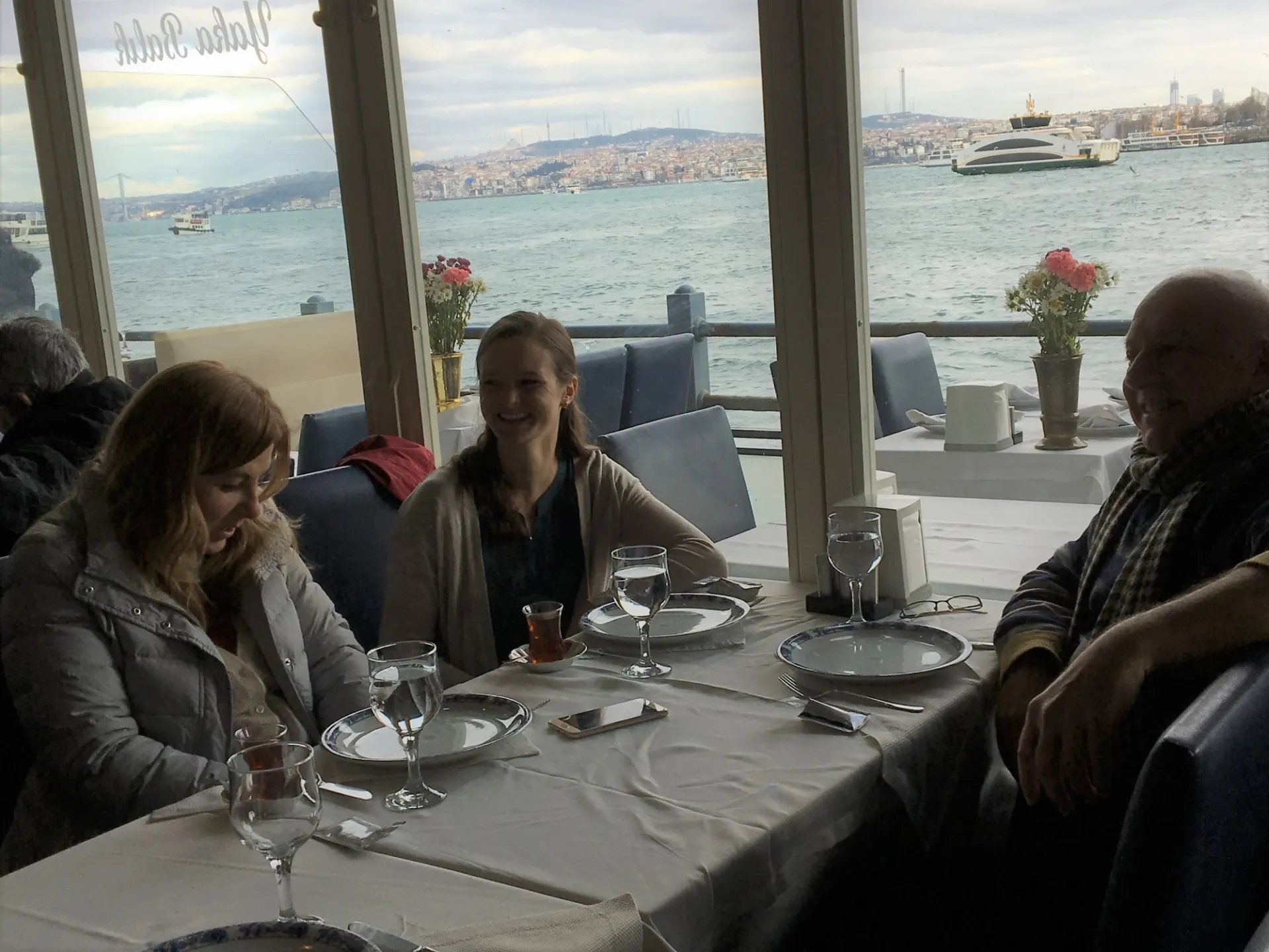 Drs. Uğur Tekin and Deniz Yukseker, Providers ASPIRE leads from Istanbul Aydin University, and Melissa Meinhart, ASPIRE's Project Director, at a dinner meeting