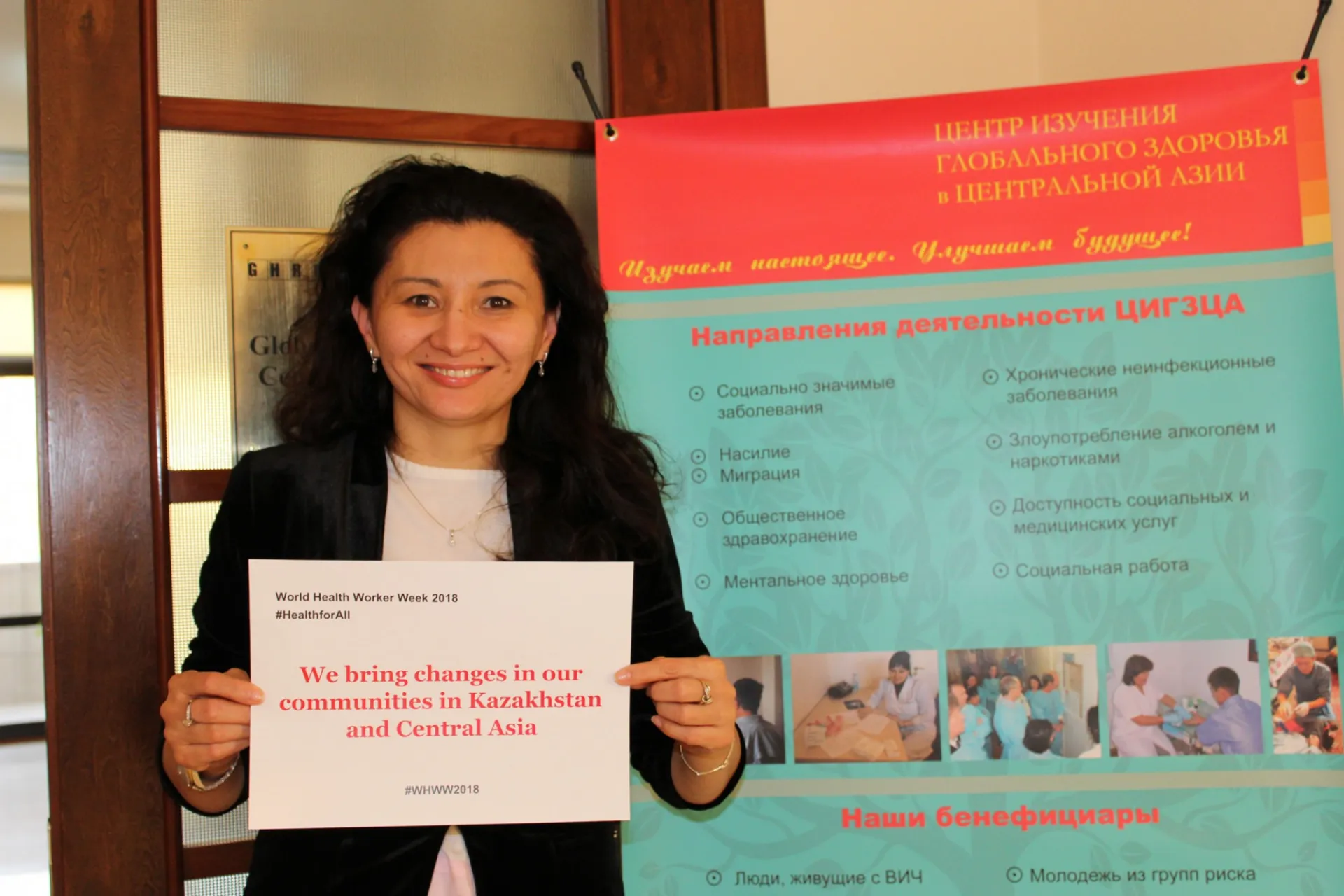 Sholpan Primbetova holding a sign promoting health