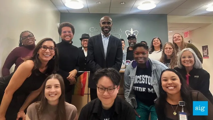 A group of people smiling at the camera