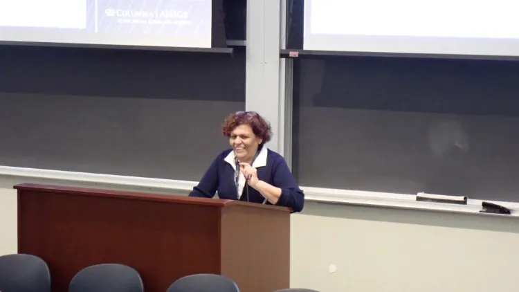 A woman standing at a lectern