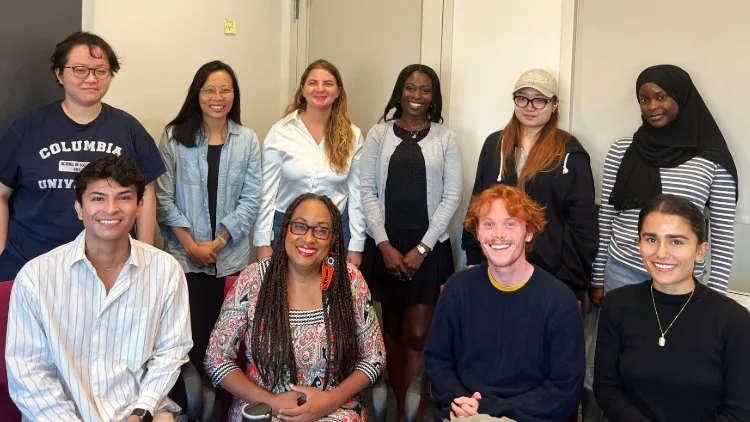 a group of students and Dawn Goddard-Eckrich smiling at the camera