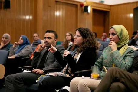 audience member asking a question at the event