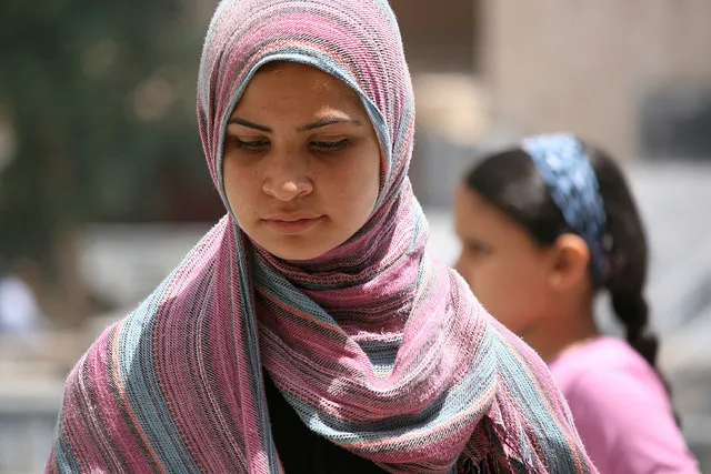 Syrian woman looking down 