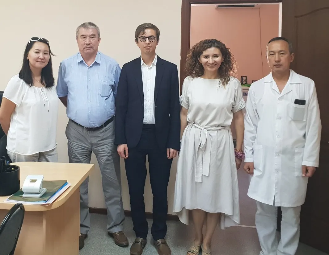 Photo of Jake and GHRCCA staff during visit 