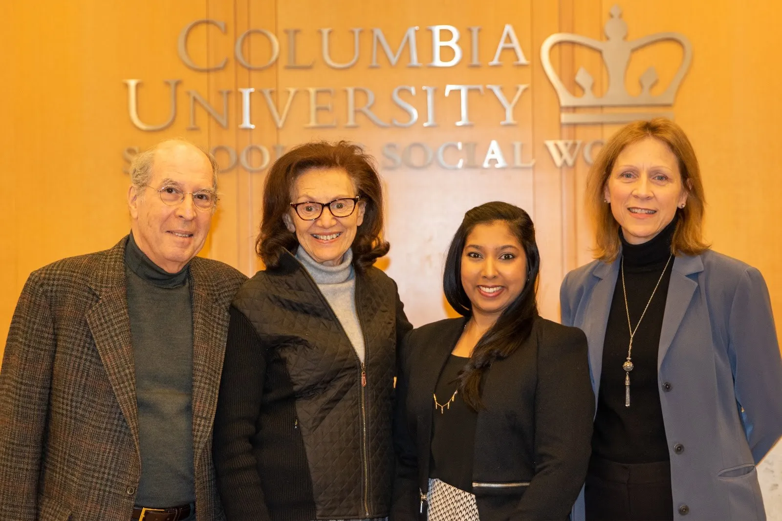 standing in front of Columbia sign 