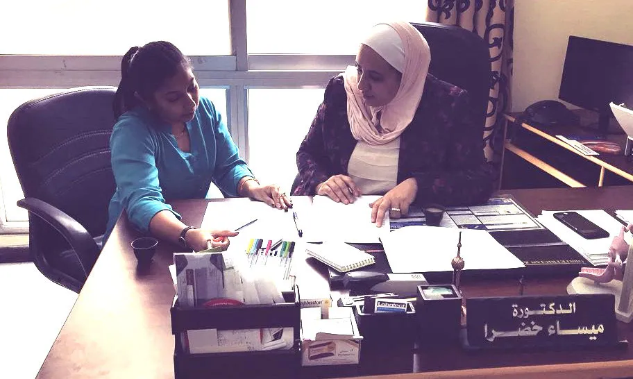 two women discussing a project