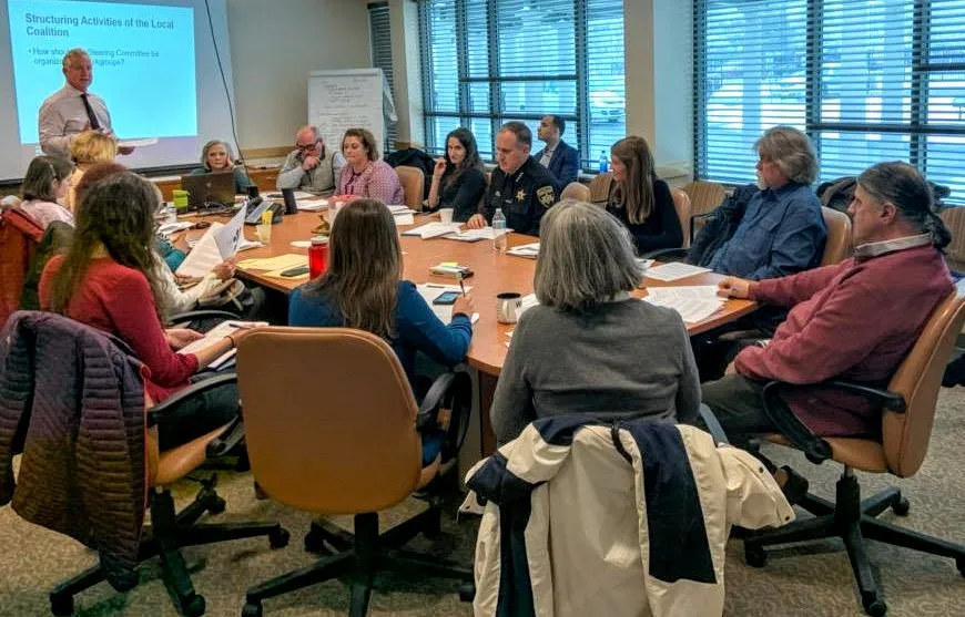 Cayuga County HEALing Communities Steering Committee meeting around a table