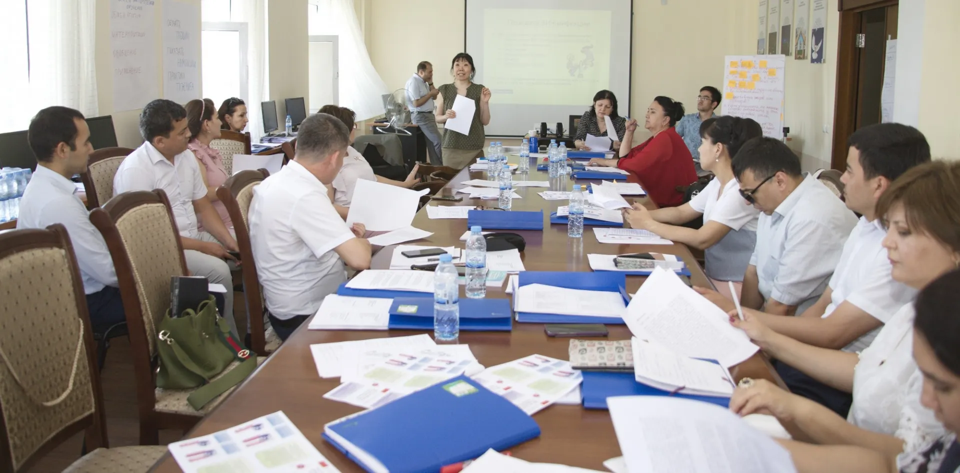 USWEEP Project Manager Lyudmila Kim delivers training to a full table of participants