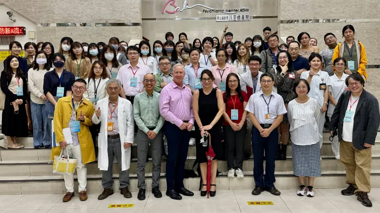 a large group of people posing for a picture