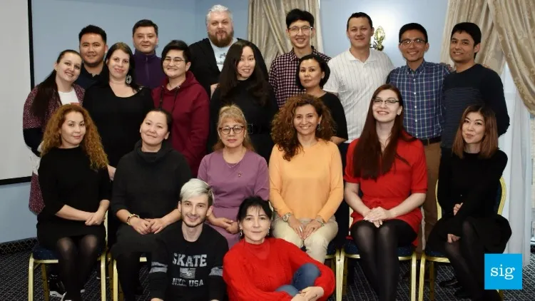 a large group of people all posing for a photo
